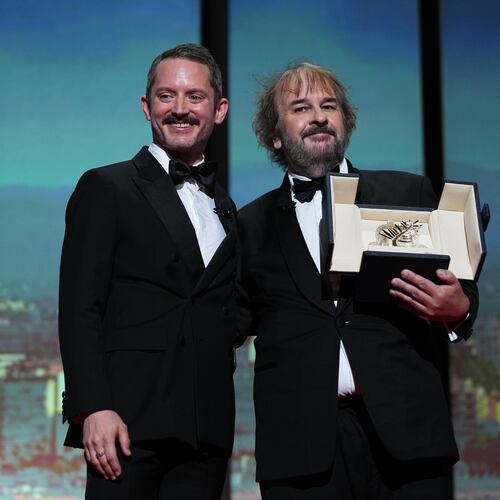 Elijah Wood, from left, and director Peter Jackson, recipient of the honorary Palme d'Or, pose for photographers during the opening ceremony of the 79th international film festival, Cannes, southern France, Tuesday, May 12, 2026. (Photo by Scott A Garfitt/Invision/AP)