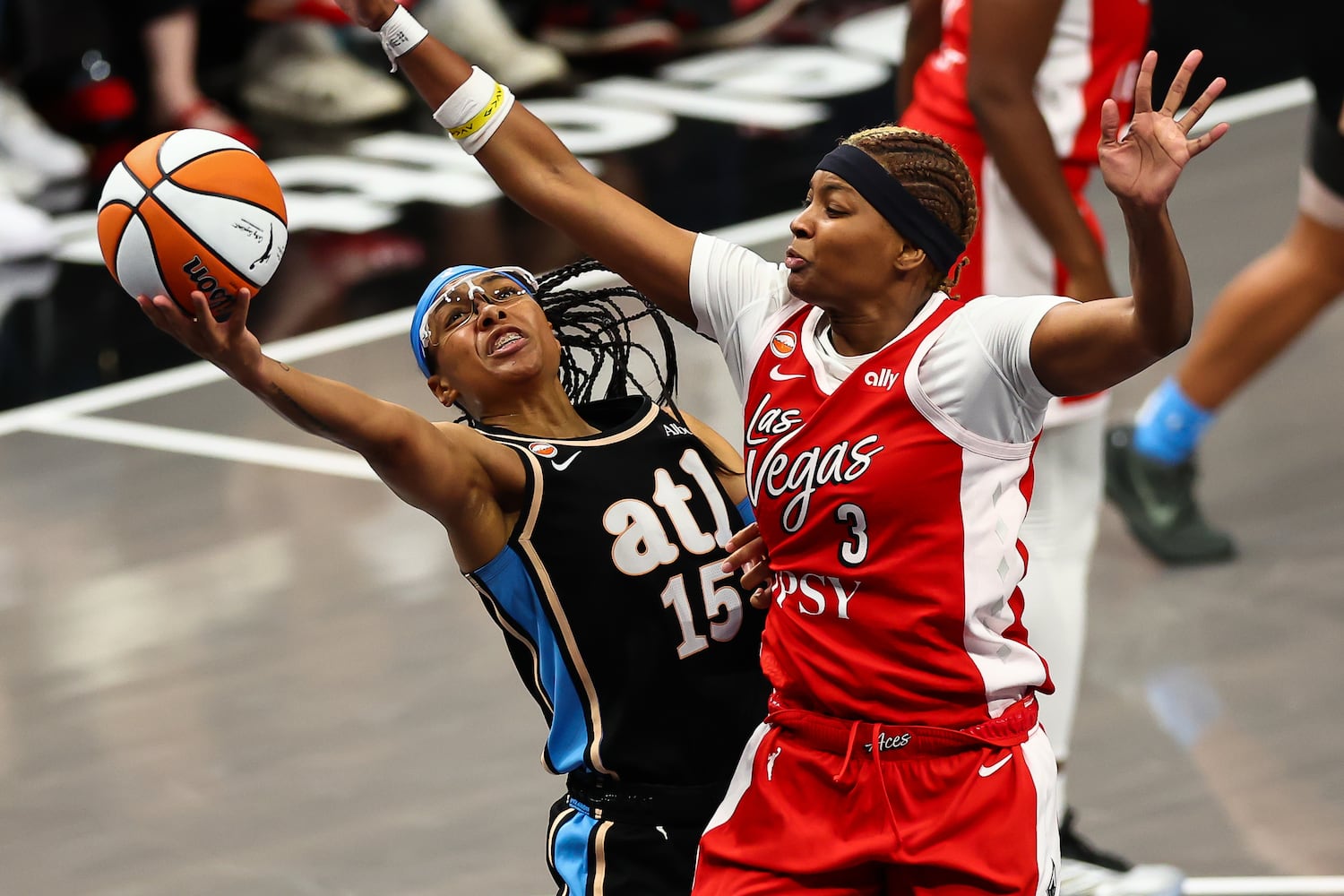 Atlanta Dream guard Allisha Gray (15) shoots against Las Vegas Aces forward NaLyssa Smith (3) during the second half of a WNBA game at State Farm Arena on Sunday, May 17, 2026, in Atlanta. (Colin Hubbard for the AJC) 