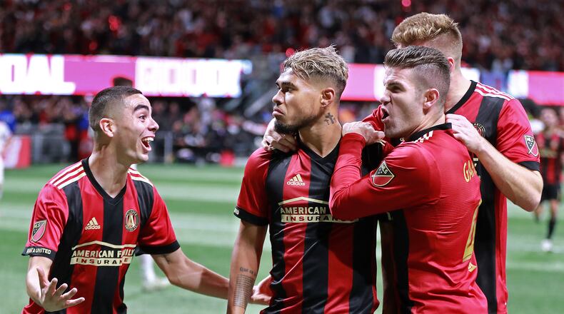 Nov 25, 2018 Atlanta: Atlanta United players Miguel Almiron (from left), Josef Martinez, and Greg Garza start the celebration after Martinez scored a goal for a 1-0 lead over the New York Red Bulls during the first half in their Eastern Conference finals MLS soccer game on Sunday, Nov. 25, 2018, in Atlanta. United went on to beat the Red Bulls 3-0. Curtis Compton/ccompton@ajc.com