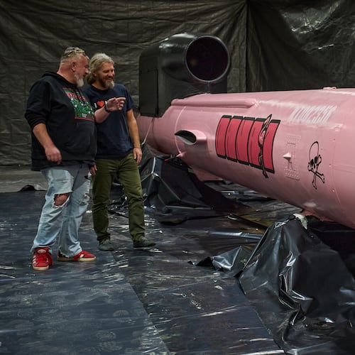 Jan Polak, right, and Martin Ondracek from the Czech organization, Weapons to Ukraine, look at a Flamingo cruise missile which was paid for by their crowdfunding campaign, at the Fire Point factory at an undisclosed location in Ukraine, Sunday, Nov. 16, 2025. (AP Photo/Efrem Lukatsky)