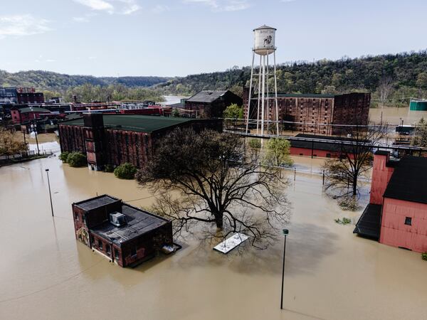 In an aerial view, the flooded Buffalo Trace Distillery is seen on Monday, April 7, 2025, in Frankfort, Ky. (AP Photo/Jon Cherry)