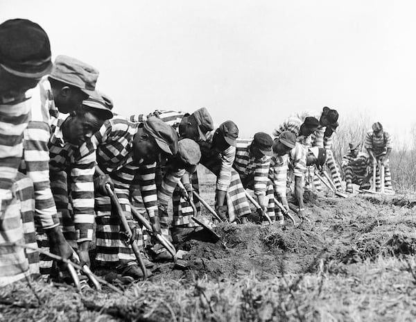 Chain gangs, such as this one in Bibb County in 1937, were not uncommon in Georgia. Fulton County's chain gang was in operation until 1943. (Courtesy of AP)