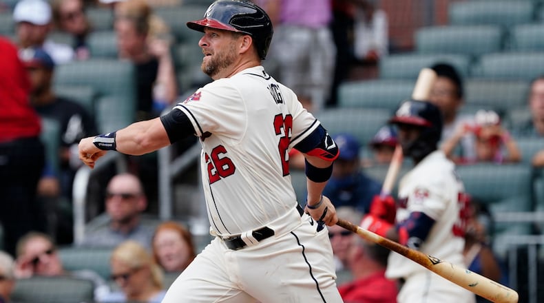 Braves new catcher Stephen Vogt follows through on a single in the fourth inning against the Tampa Bay Rays on Sunday, July 18, 2021, at Truist Park in Atlanta.