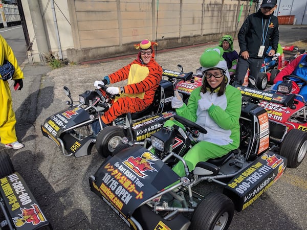 Nate and Jessica Baumgart quit their jobs and sold nearly everything they owned before setting off for a trip around the world last year. The couple is pictured here in costume racing go-karts n Osaka, Japan. CONTRIBUTED