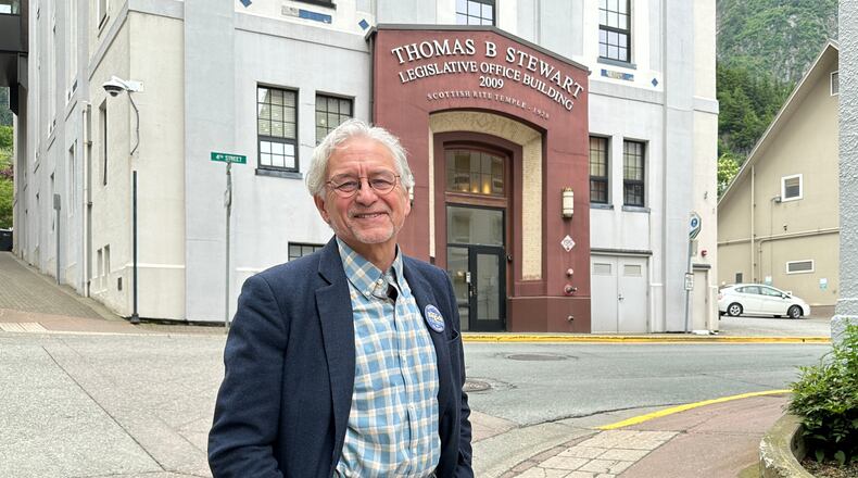 FILE - DDemocratic gubernatorial candidate Tom Begich poses for a photo in downtown Juneau, Alaska, June 17, 2026. (AP Photo/Becky Bohrer, File)