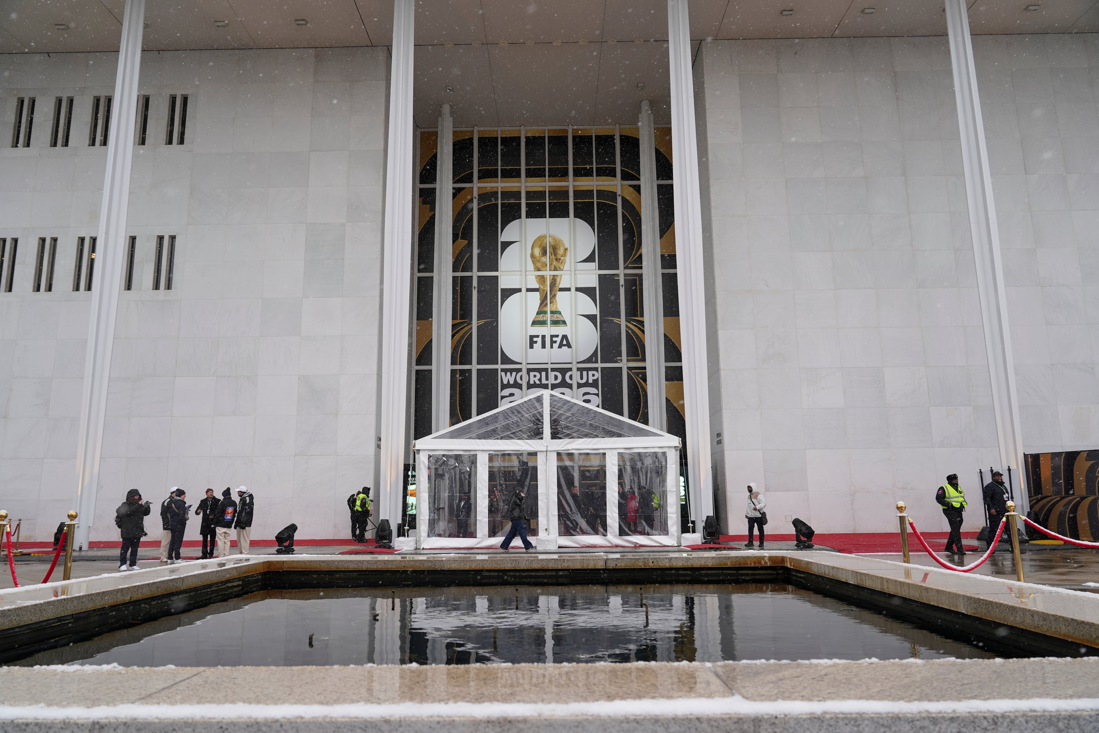 People arrive for the draw for the 2026 soccer World Cup at the Kennedy Center in Washington, Friday, Dec. 5, 2025. (AP Photo/Stephanie Scarbrough)