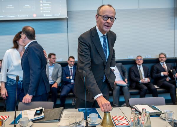 Friedrich Merz, CDU/CSU parliamentary group leader in the Bundestag and CDU federal chairman, speaks at the start of the parliamentary group meeting in the Bundestag, Berlin, Friday, March 14, 2025. (Michael Kappeler/dpa via AP)