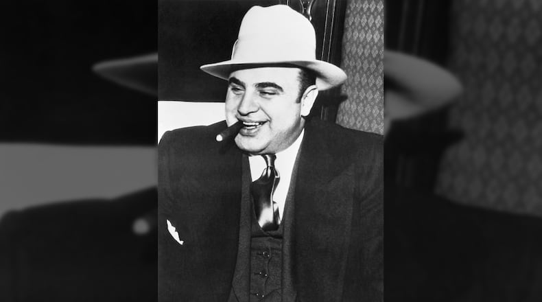 Gangster Al Capone in the heavily guarded train which bore him to federal prison.