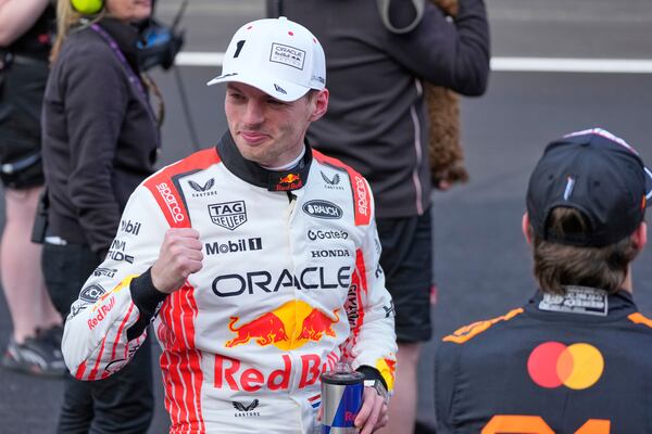 Red Bull driver Max Verstappen of the Netherlands celebrates after qualifying session for the Japanese Formula One Grand Prix at the Suzuka Circuit in Suzuka, central Japan, Saturday, April 5, 2025. (AP Photo/Hiro Komae)
