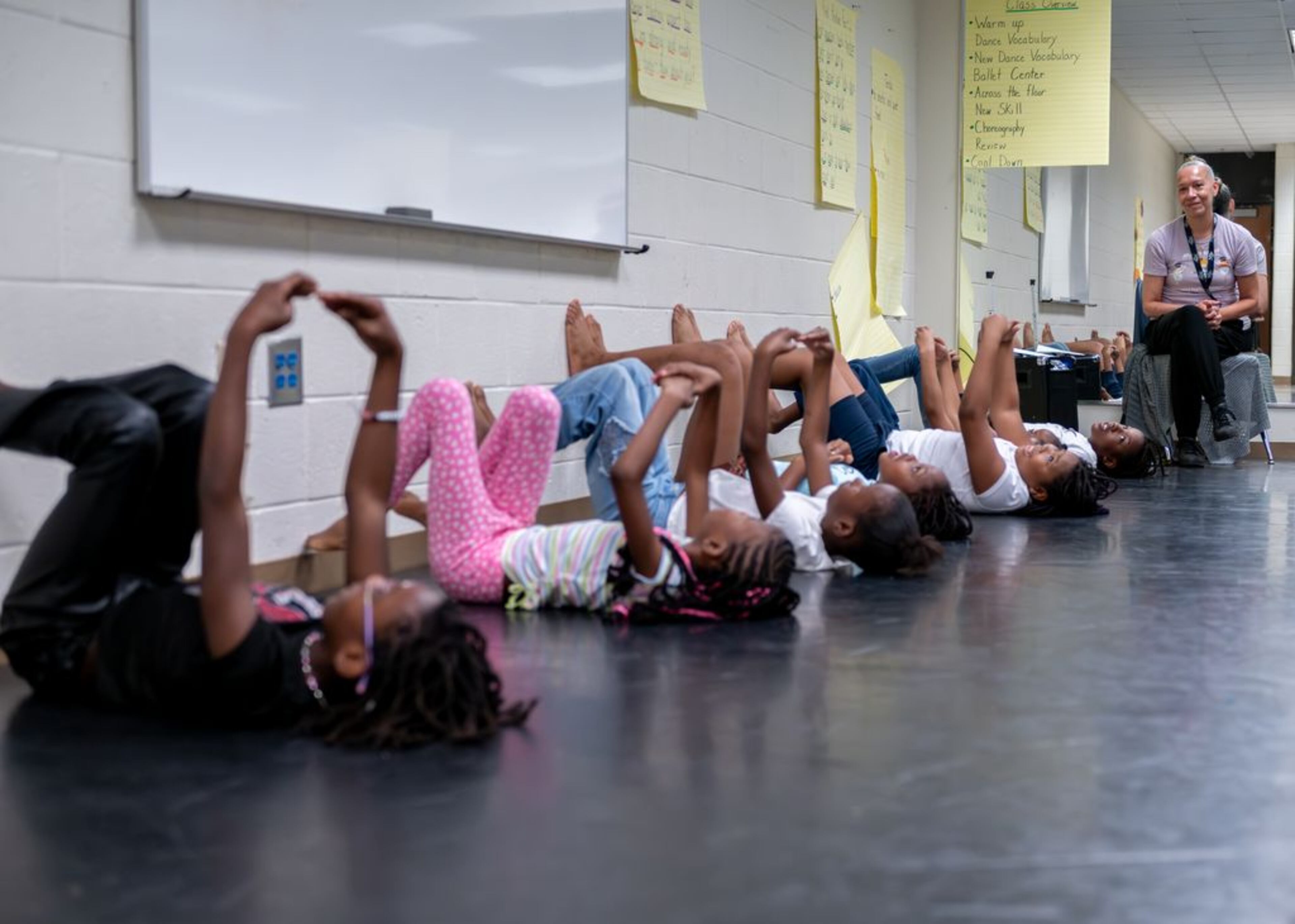 Atlanta Ballet Centre for Dance Education students are under the direction of Diane Caroll (right). More than 1,200 students are involved in community engagement programs that integrate dance classes into the curriculum at local schools and community centers, offering programs before, during and after school.(Courtesy of Amber Times)