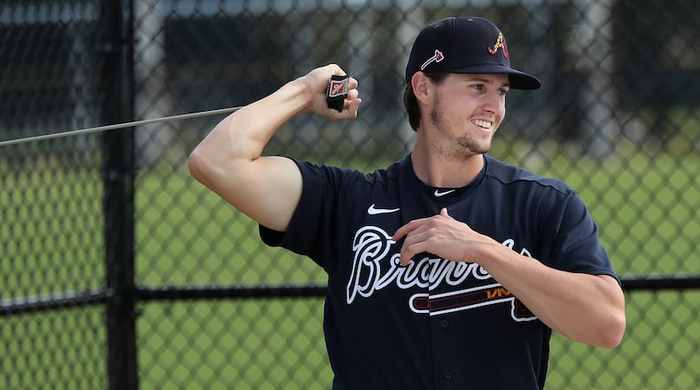 Braves pitcher Kyle Wright loosens up his throwing arm Sunday, Feb. 16, 2020, at spring training camp at CoolToday Park in North Port, Fla.