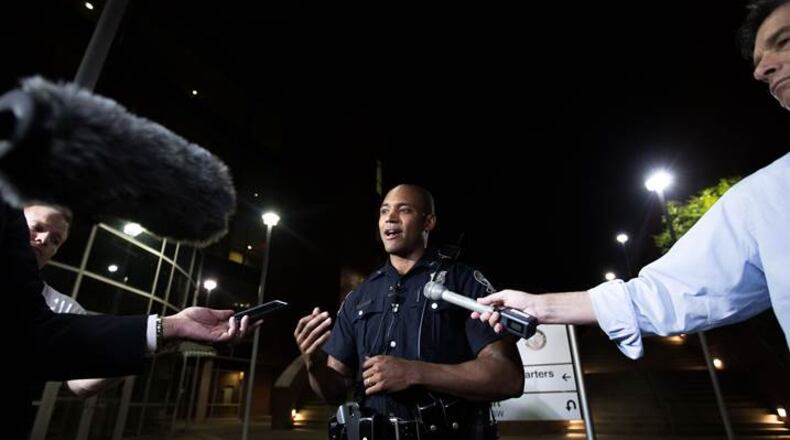 Atlanta police spokesman Officer Ralph Woolfolk speaks Thursday night regarding a carjacking incident that ended with a baby abandoned on a southeast Atlanta street. BRANDEN CAMP / SPECIAL