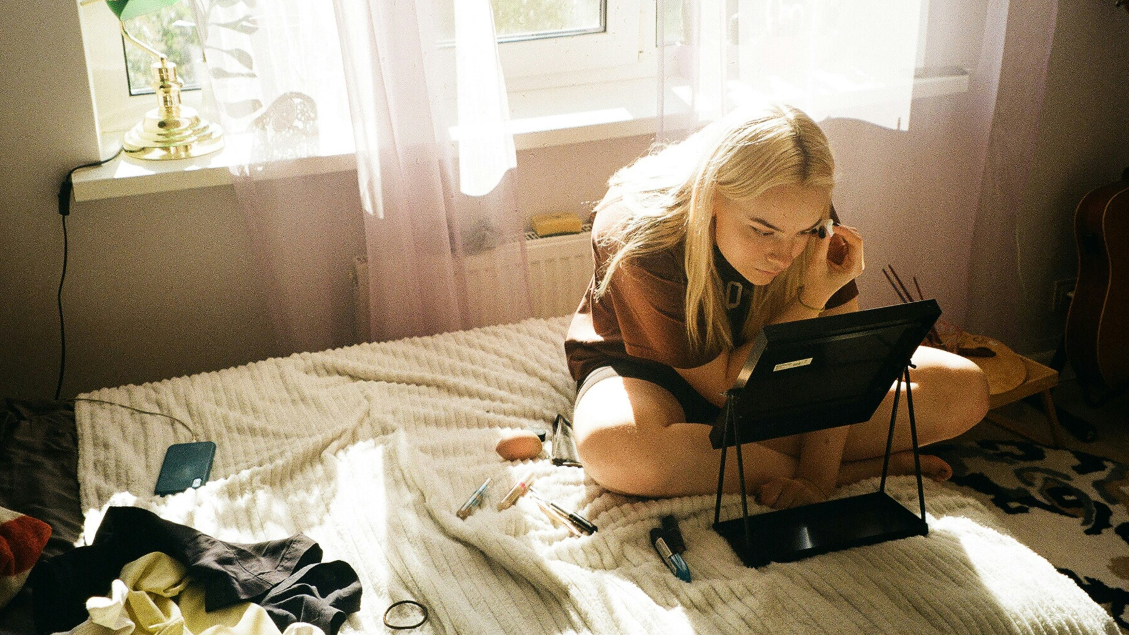 Even at home, simple rituals like changing clothes, brushing your hair or opening the blinds can completely shift your mindset. (Krišjānis Kazaks/Unsplash)