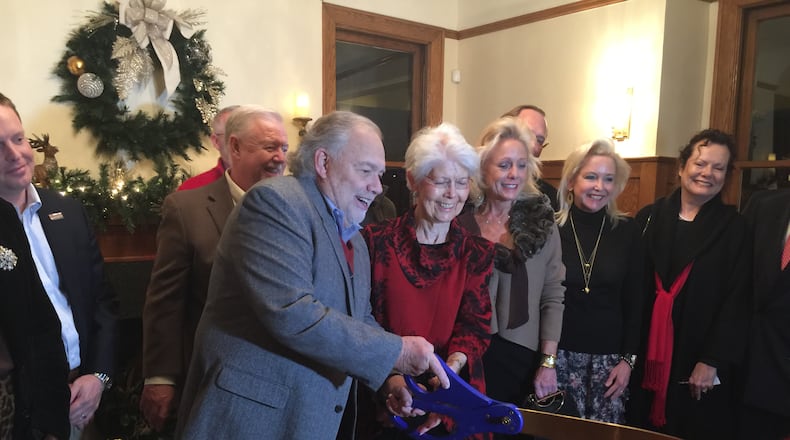 Smyrna Mayor Max Bacon cut the ribbon at the Dec. 11 opening of the city’s Reed House, 3080 Atlanta Road, for use as a special event facility. Courtesy of Smyrna