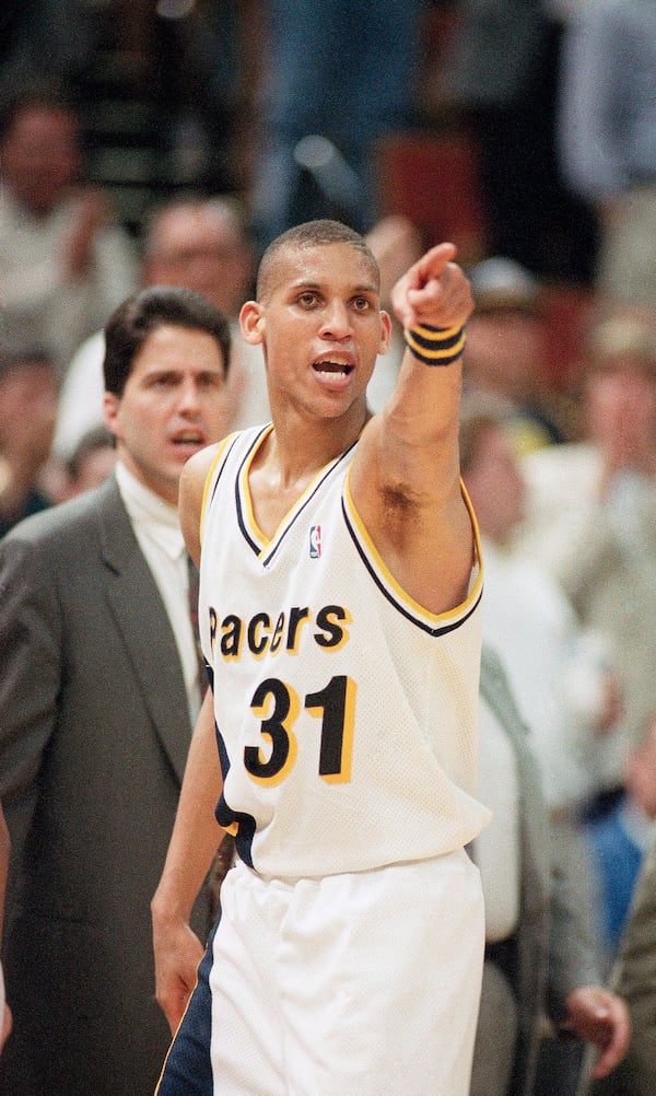 FILE - Indian Pacers' Reggie Miller (31) does a little trash talking in the direction of the New York Knicks as he leaves the court late in the fourth quarter during Game 3 of the first round of the NBA Playoffs in Indianapolis, May 5, 1993. (AP Photo/Ron Hoskins, File)