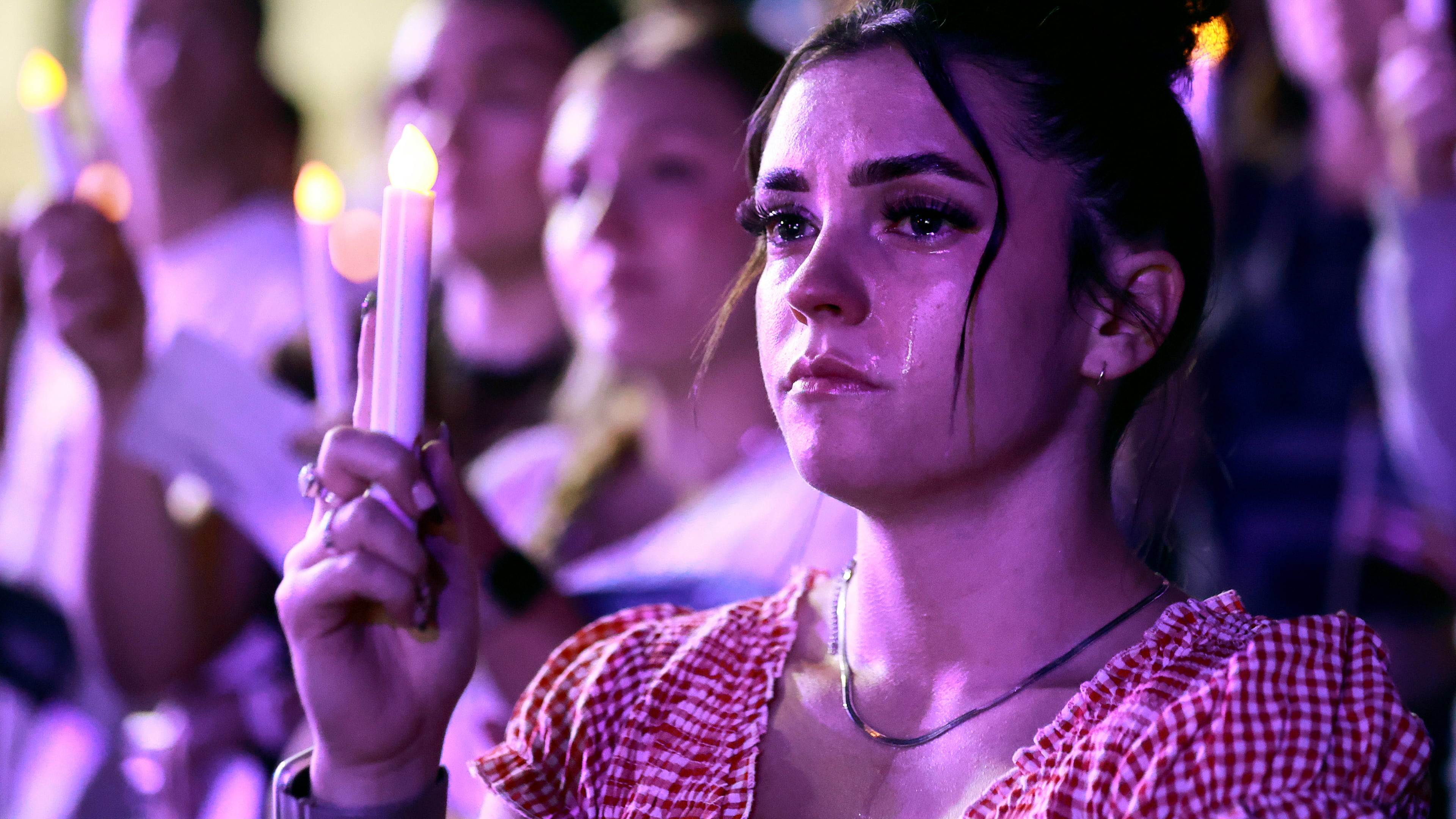 Tears stream down Alexa Maliwauki's face as she attends a Vigil for Unity at the UCCU Center at Utah Valley University in Orem on Friday, Sept. 19, 2025. Charlie Kirk, conservative activist and the founder and president of Turning Point USA, was fatally shot while answering questions at his American Comeback Tour at UVU on Sept. 10. (Kristin Murphy/The Deseret News via AP)