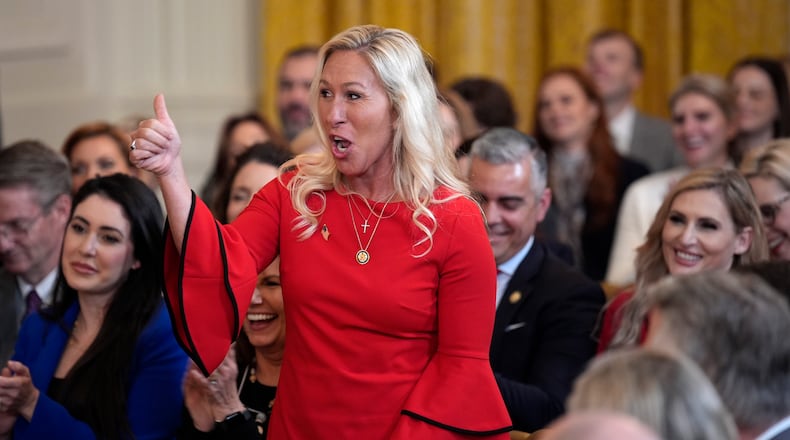 Congresswoman Marjorie Taylor Greene, seen here during a bill signing ceremony at the White House in February, has come under renewed criticism about stock trading by members of Congress. (Yuri Gripas/Abaca Press/TNS)