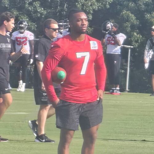 Bijan Robinson watches practices Friday, July 31, 2026 as he reportedly is looking to get a new contract. (Rod Beard/AJC)