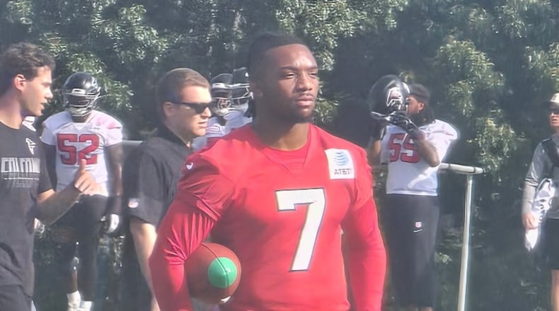 Bijan Robinson watches practices Friday, July 31, 2026 as he reportedly is looking to get a new contract. (Rod Beard/AJC)