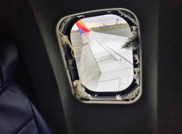 This April 17, 2018 photo provided by Marty Martinez shows the window that was shattered after a jet engine of a Southwest Airlines airplane blew out at altitude, resulting in the death of a woman who was nearly sucked from the window during the flight of the Boeing 737 bound from New York to Dallas with 149 people aboard, shown after it made an emergency landing in Philadelphia.