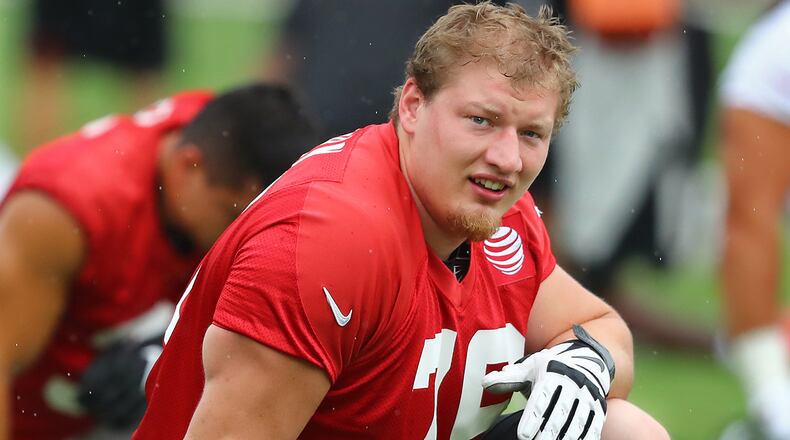 Falcons offensive tackle Kaleb McGary loosens up for the second practice at training camp on Tuesday, July 23, 2019, in Flowery Branch.