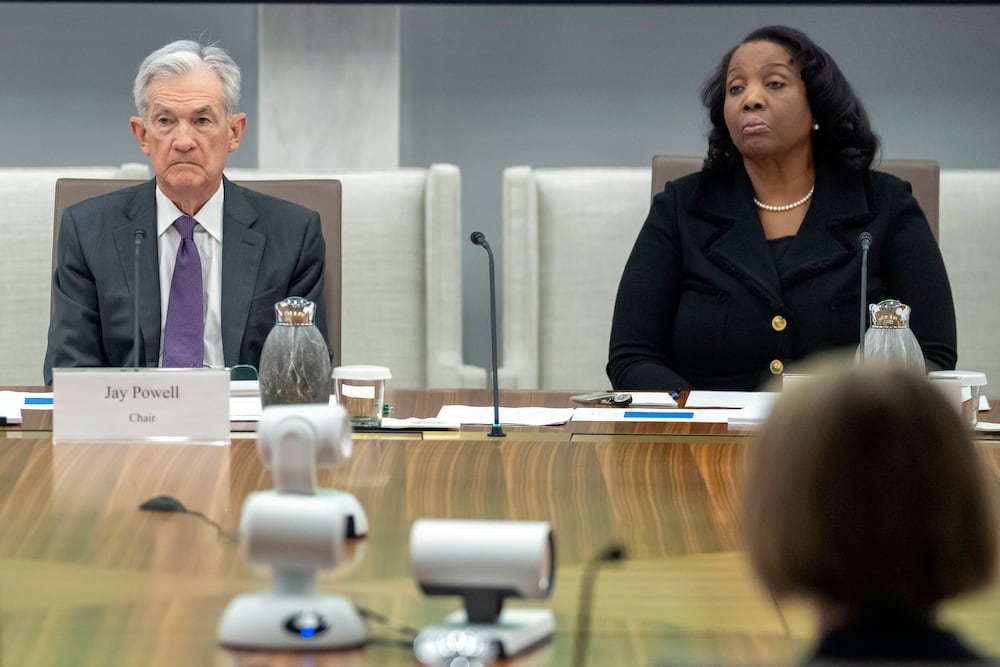 Federal Reserve Chair Jerome Powell and Lisa Cook, a member of the board of governors, listened to discussion during a June meeting.