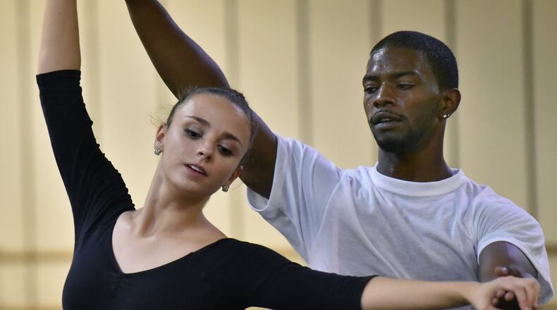Colette Tilinski (left) and Corrick Jones rehearse their roles of Sugar Plum Fairy and Cavalier at Metropolitan Ballet Theatre in Alpharetta. HYOSUB SHIN / HSHIN@AJC.COM