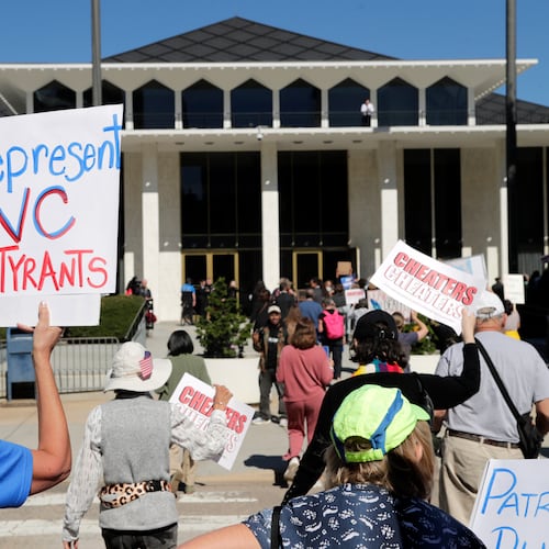 FILE - Demonstrators approach the Legislative Building during a rally protesting a proposed election redistricting map, Oct. 21, 2025, in Raleigh, N.C. (AP Photo/Chris Seward, File)