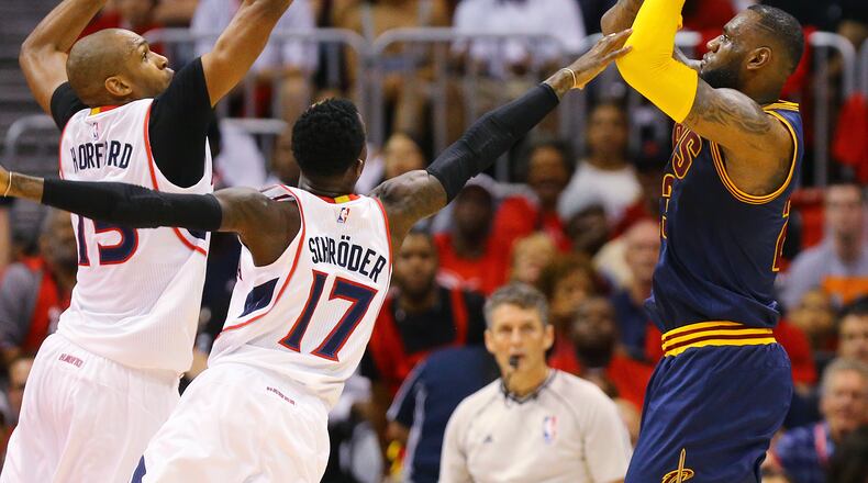 Hawks Al Horford and Dennis Schroder double team Cavaliers LeBron James who gets off a shot in game 1 of the Eastern Conference Finals on Wednesday, May 20, 2015, in Atlanta. Curtis Compton / ccompton@ajc.com