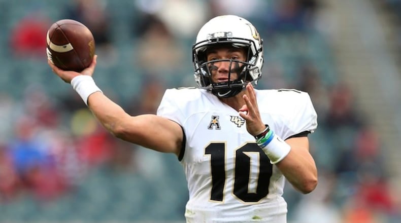Central Florida quarterback McKenzie Milton (10) attempts a pass against Temple during the first quarter in an NCAA college football game Saturday, Nov. 18, 2017, in Philadelphia. UCF defeated Temple 45-19. (AP Photo/Rich Schultz)