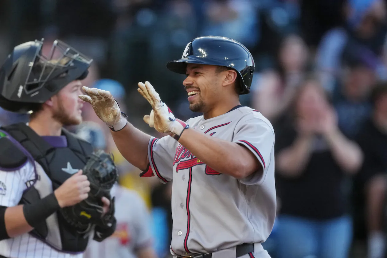 The Braves' Drake Baldwin (right) celebrates as he crosses home plate after hitting a two-run home run in the first inning Saturday, May 2, 2026, in Denver. Baldwin went 3-for-4 with four RBIs, a walk and a run. (David Zalubowski/AP)