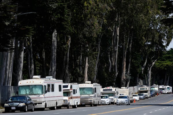 Parked RVs are seen on Lake Merced Boulevard in San Francisco, Tuesday, July 15, 2025. (AP Photo/Godofredo A. Vásquez)