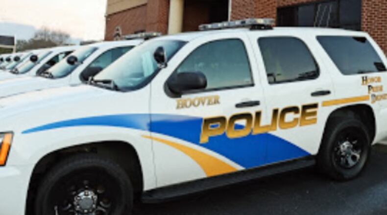 An Alabama police chief says one of his officers has been fired after posting a photo on social media that depicted a protester in the crosshairs of a rifle scope.