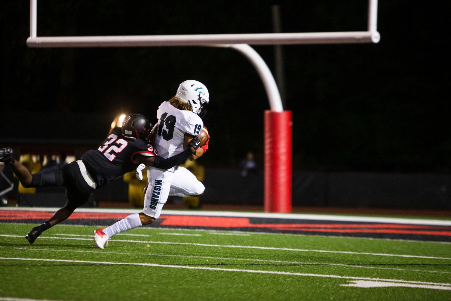 Cayden Lee, wide receiver for Kennesaw Mountain, gets tackled by Charles Pierce, cornerback for Osborne. CHRISTINA MATACOTTA FOR THE ATLANTA JOURNAL-CONSTITUTION.