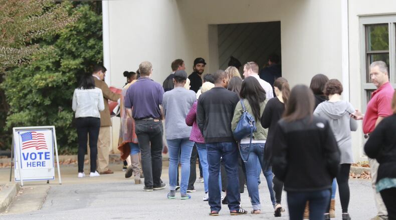 Voters wait to cast their votes at the Life Church Smyrna Assembly of God in Smyrna on Tuesday, Nov. 8, 2016.