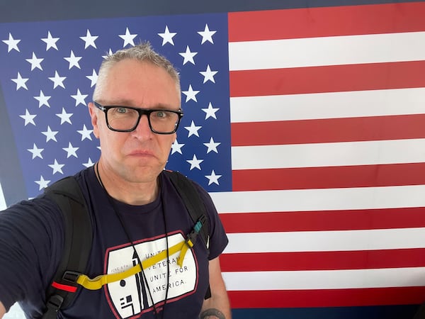 In this photo provided by Joe Plenzler, U.S. Marine Corps veteran Joe Plenzler poses in Washington, June 6, 2025, during the Unite For Veterans Coalition protest, which he helped organize. (Joe Plenzler, via AP)
