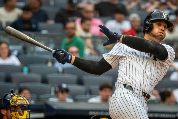 New York Yankees' J.C. Escarra bats during the seventh inning of a baseball game against the Milwaukee Brewers, Saturday, March 29, 2025, in New York. (AP Photo/Angelina Katsanis)