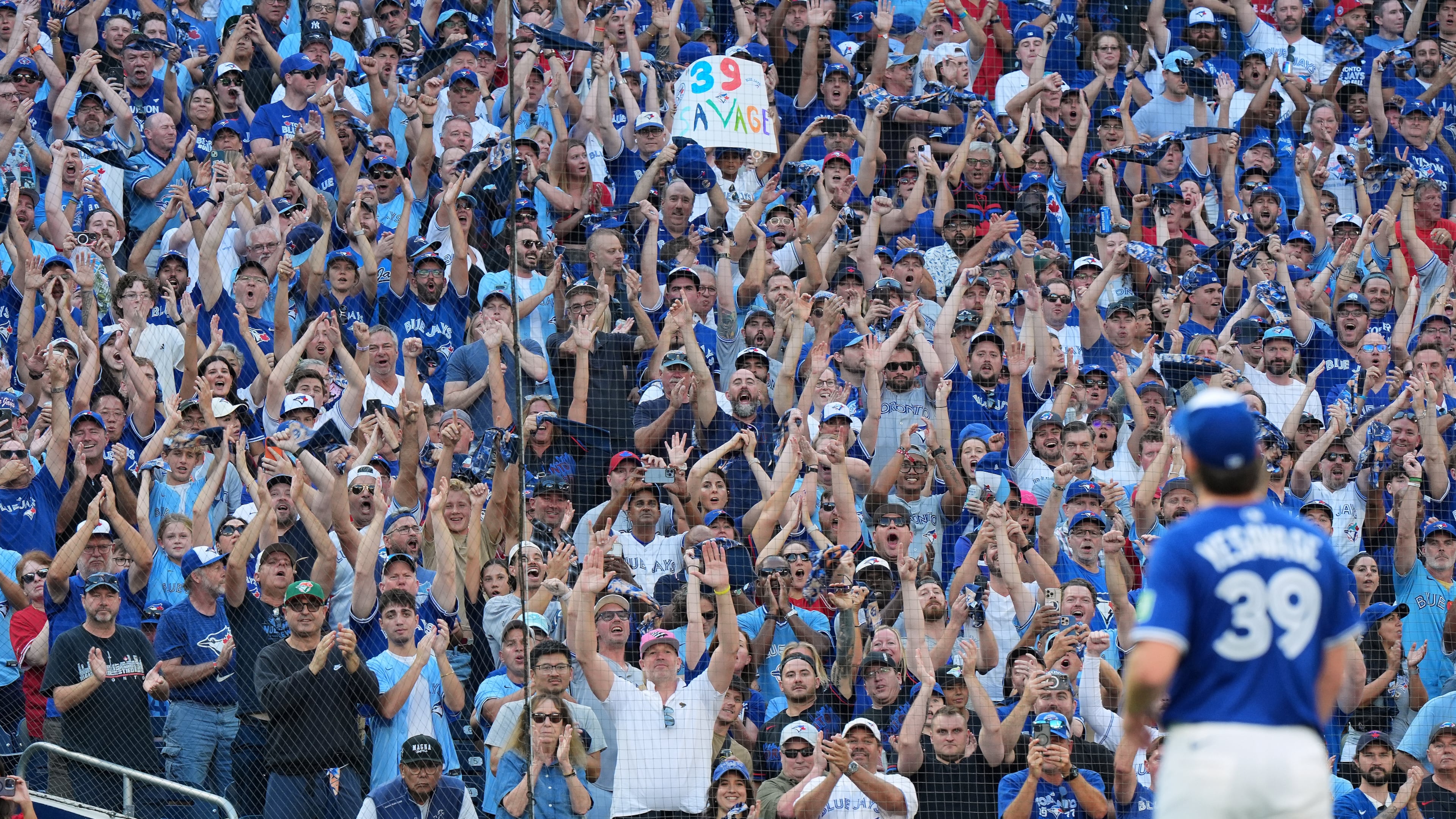 Fans give a standing ovation as Toronto Blue Jays pitcher Trey Yesavage (39) leaves the mound after being pulled during the sixth inning of Game 2 of baseball's American League Division Series against the New York Yankees in Toronto, Sunday, Oct. 5, 2025. (Frank Gunn/The Canadian Press via AP)