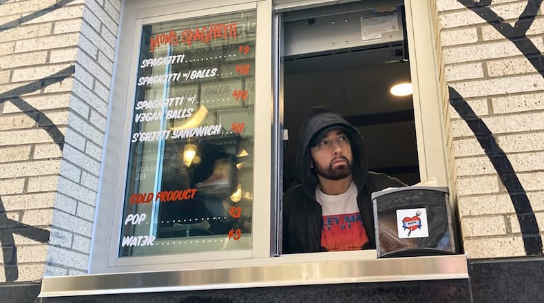 Eminem works the window of Mom's Spaghetti in Detroit on Wednesday.