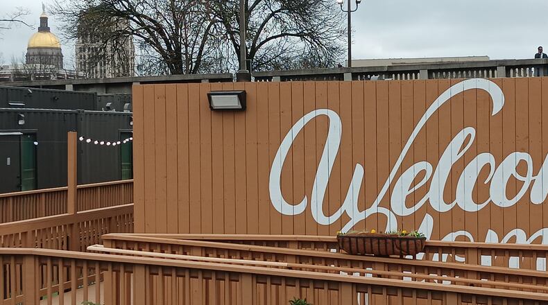 Georgia's state capitol dome is visible from porches at The Melody, a 40-unit development of housing for the homeless made from old shipping containers.