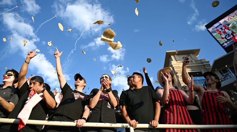 Texas Tech students throw tortillas before the NCAA college football game against Kansas, Saturday, Oct. 11, 2025, in Lubbock, Texas. (AP Photo/Annie Rice)