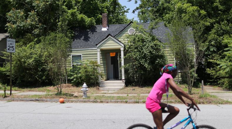Code enforcement officers have tried for years to find the owner of this Atlanta home, but state corporate disclosure laws make it difficult. Ben Gray / bgray@ajc.com