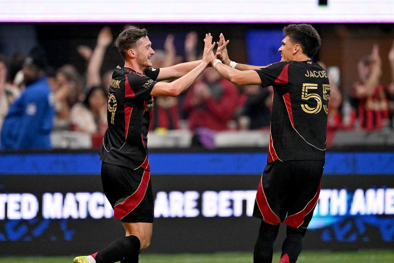 Atlanta United midfielder Aleksey Miranchuk (59) celebrates with Atlanta United defender Tomás Jacob (55) after scoring a goal during the second half in Atlanta United's home opener at Mercedes-Benz Stadium, Saturday, March 7, 2026, in Atlanta. Real Salt Lake won 3-2 over Atlanta United. (Hyosub Shin/AJC)