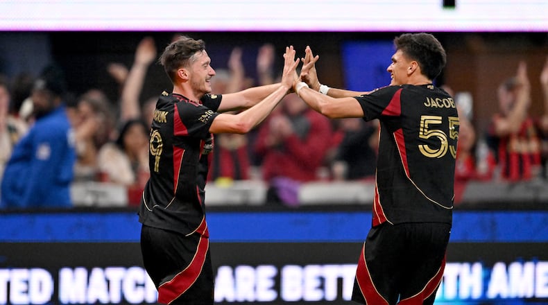 Atlanta United midfielder Aleksey Miranchuk (59) celebrates with Atlanta United defender Tomás Jacob (55) after scoring a goal during the second half in Atlanta United's home opener at Mercedes-Benz Stadium, Saturday, March 7, 2026, in Atlanta. Real Salt Lake won 3-2 over Atlanta United. (Hyosub Shin/AJC)