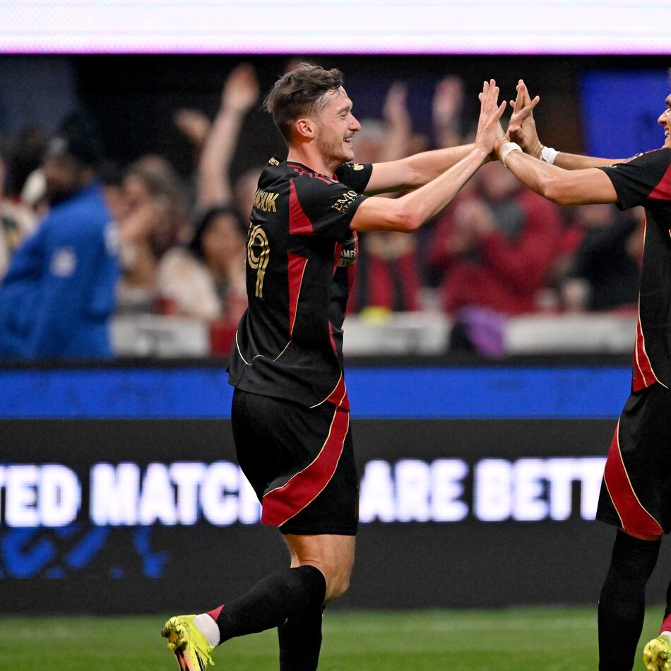 Atlanta United midfielder Aleksey Miranchuk (59) celebrates with Atlanta United defender Tomás Jacob (55) after scoring a goal during the second half in Atlanta United's home opener at Mercedes-Benz Stadium, Saturday, March 7, 2026, in Atlanta. Real Salt Lake won 3-2 over Atlanta United. (Hyosub Shin/AJC)