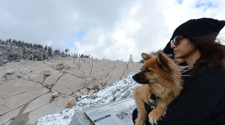 Niki Cloyd, of Los Angeles, and her dog Izzy take in the view on Thursday, Sept. 21, 2017 from Olmsted Point in northern Yosemite National Park in the central Sierra Nevada mountains of California. (Dan Honda/Bay Area News Group/TNS)