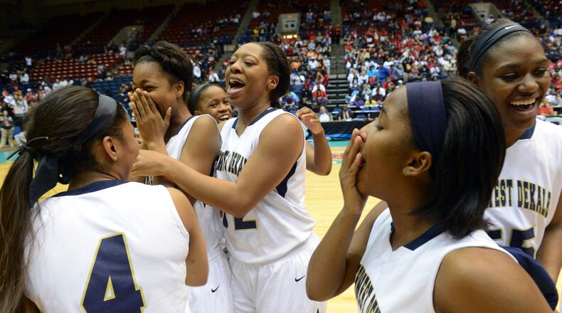 MARCH 8, 2013 MACON Dekalb's Southwest DeKalb Panthers players celebrate their win over cross-county rivals Miller Grove Wolverines in their state AAAA girls championship game at the Macon Coliseum, Friday, March 8, 2013. Southwest DeKalb Panthers won over Miller Grove Wolverines 56-52. Kent D. Johnson/ kdjohnson@ajc.com