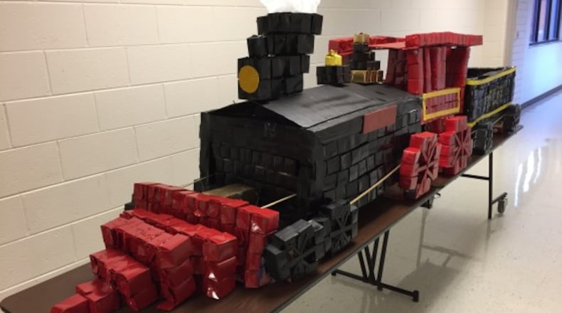 This is "Little General" — a locomotive model made from 1,000 recycled milk cartons by Valerie King's second-grade class at Kennesaw Elementary. The school won $1,000 from Evergreen Packaging for the "invention."
