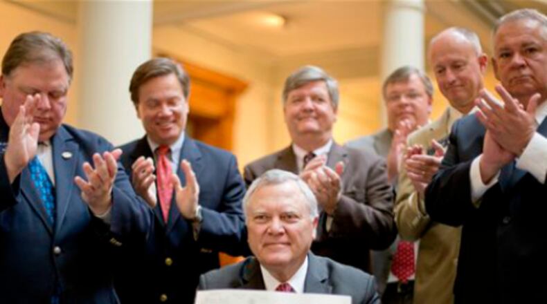 Gov. Nathan Deal faces a Tuesday deadline to sign or veto bills.
