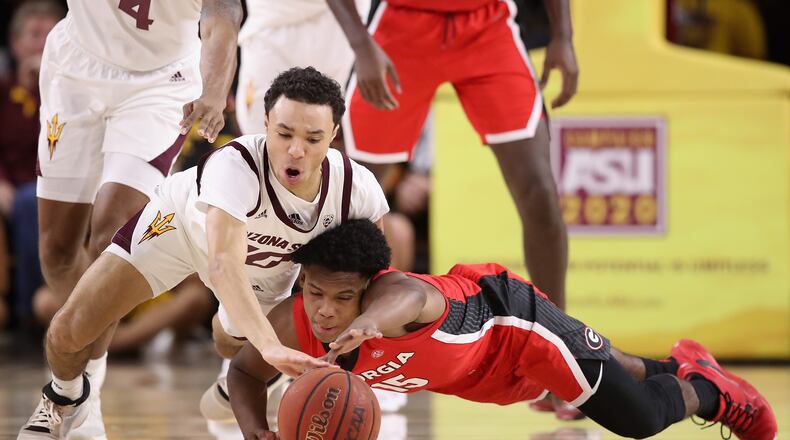 Jaelen House (left) of the Arizona State Sun Devils and Sahvir Wheeler of the Georgia Bulldogs dive for a loose ball. (Photo by Christian Petersen/Getty Images)